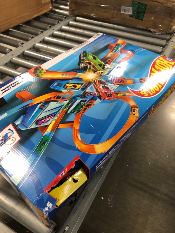 Photo 2 of Hot Wheels Track Set with 1:64 Scale Toy Car, 4 Intersections for Crashing, Powered by a Motorized Booster, Criss-Cross Crash Track????