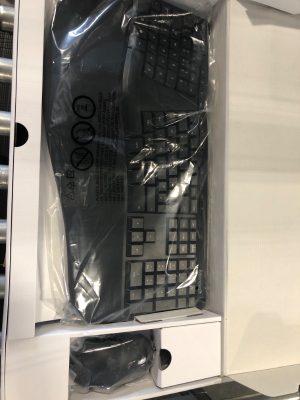 Photo 2 of Microsoft Ergonomic Desktop - Black - Wired, Comfortable, Ergonomic Keyboard and Mouse Combo, with Cushioned Wrist and Palm Support. Split Keyboard. Dedicated Office Key.