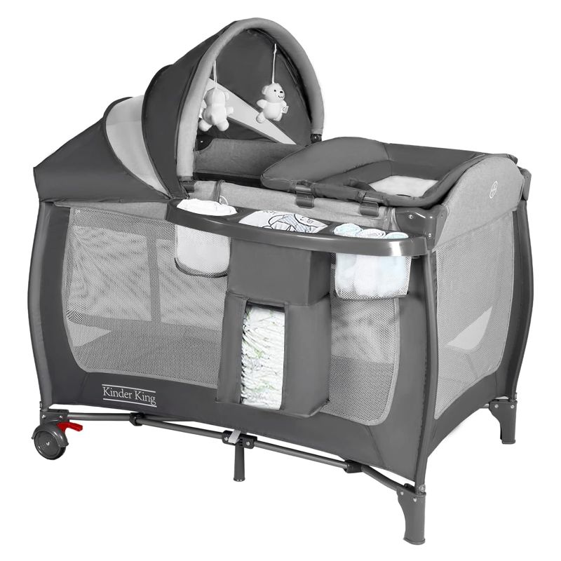 Photo 1 of Kinder King 4 in 1 Portable Pack n Play, Baby Nursery Center Playard w/Bassinet, Large Playpen for Infant and Toddler, Newborn Changing Table, Adjustable Canopy, Storage Basket, Travel Bag, Grey