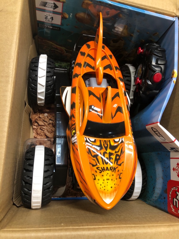 Photo 2 of Hot Wheels Monster Trucks, Remote Control Car, Monster Truck Toy with All-Terrain Wheels, 1:15 Scale Unstoppable Tiger Shark RC