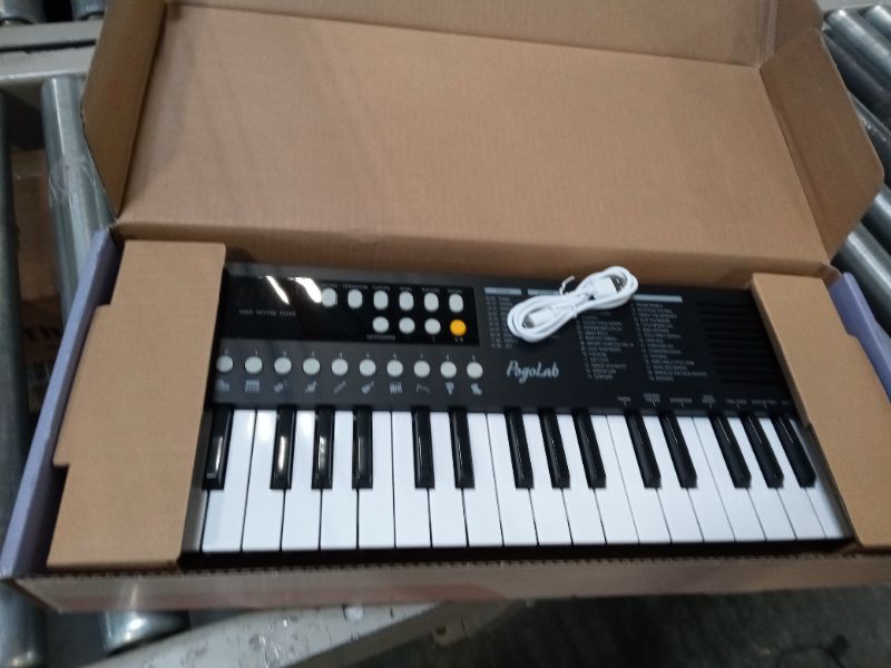 Photo 1 of POGOLAB 37 Keys Small Keyboard Piano, Mini Portable Digital Piano Keyboard with Transpose and Octave Function, Electric Music Keyboard with Built-In Speaker & LED Display, Gift for Beginners/Adults