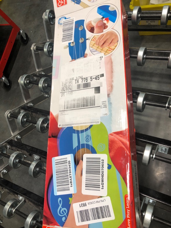 Photo 1 of Hape Kid's Wooden Toy Ukulele in Blue, L: 21.9, W: 8.1, H: 3 inch