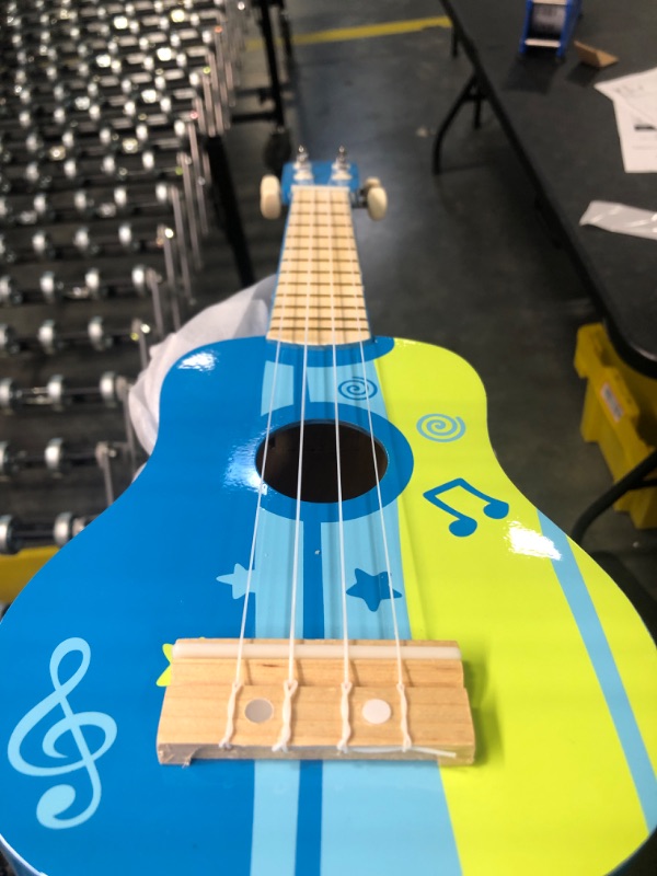 Photo 1 of Hape Kid's Wooden Toy Ukulele in Blue, L: 21.9, W: 8.1, H: 3 inch