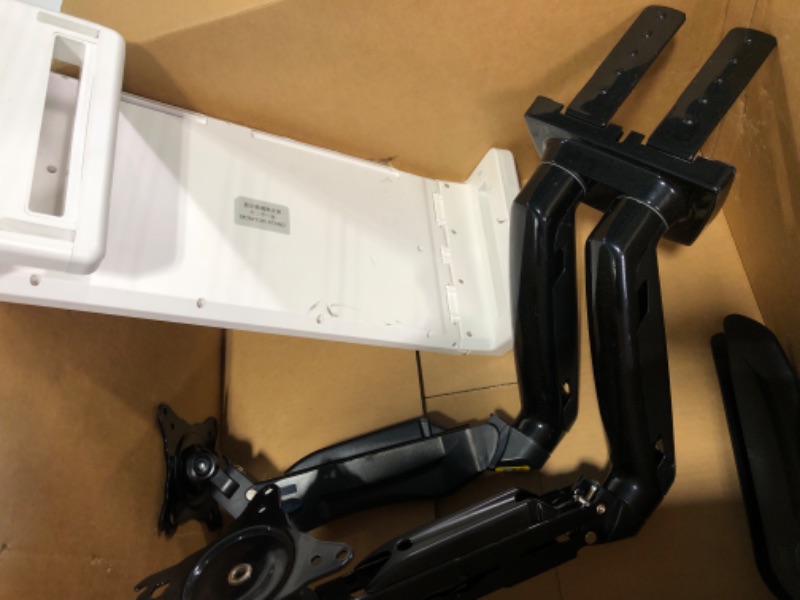 Photo 1 of HUANUO Dual Monitor Stand - Adjustable Spring Monitor Desk Mount Swivel Vesa Bracket with C Clamp