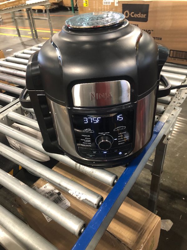 Photo 1 of Ninja FD401 Foodi 12-in-1 Deluxe XL 8 qt. Pressure Cooker & Air Fryer that Steams, Slow Cooks, Sears, Sautés, Dehydrates & More, with 5 qt. Crisper Basket, Deluxe Reversible Rack & Recipe Book, Silver 8 Quart 8-Quart/Stainless Steel Silver