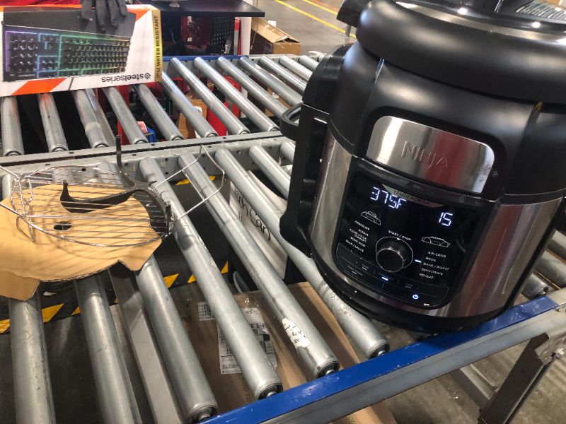 Photo 1 of Ninja FD401 Foodi 12-in-1 Deluxe XL 8 qt. Pressure Cooker & Air Fryer that Steams, Slow Cooks, Sears, Sautés, Dehydrates & More, with 5 qt. Crisper Basket, Deluxe Reversible Rack & Recipe Book, Silver 8 Quart 8-Quart/Stainless Steel Silver