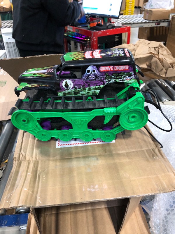 Photo 2 of **FOR PARTS ONLY, NOT FUNCTIONAL** Monster Jam, Official Grave Digger Trax All-Terrain Remote Control Outdoor Vehicle, 1:15 Scale, Kids Toys for Boys and Girls Ages 4 and up Grave Digger Trax (Retail Packaging)