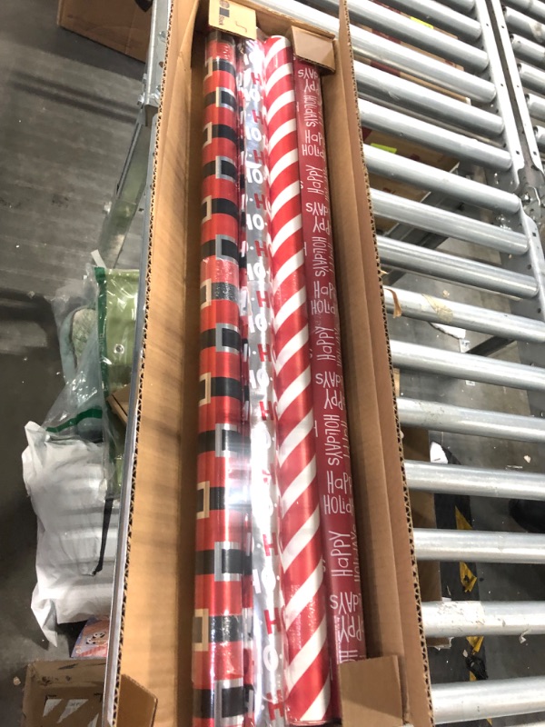 Photo 2 of American Greetings Christmas Foil Reversible Wrapping Paper, Red, Black, and Silver, Candy Cane Stripe, Snowmen, Ho-ho-ho, Santa Belt, 4-Roll, 30 inch