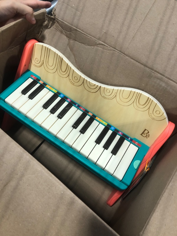 Photo 3 of B. toys wooden toy piano with songbook, piano wooden toy, music toy, musical instrument to learn to play the piano for children from 3 years old.