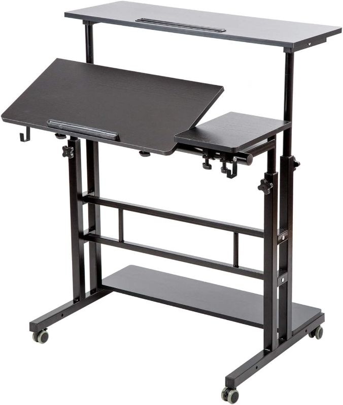 Photo 1 of **USED MISSING HARDWARE** SIDUCAL Mobile Stand Up Desk, Adjustable Laptop Desk with Wheels Storage Desk Home Office Workstation, Rolling Table Laptop Cart for Standing or Sitting, Black Standard Black