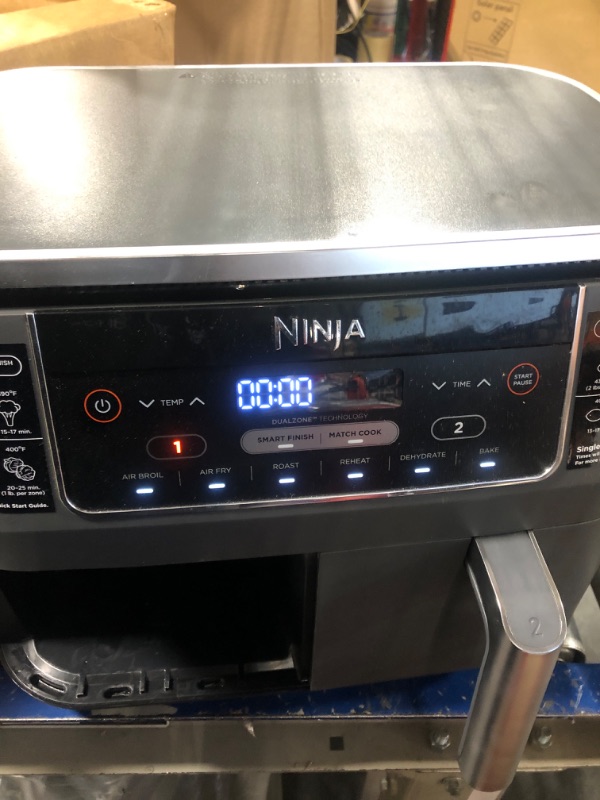 Photo 1 of **USED** Ninja DZ201 Foodi 8 Quart 6-in-1 DualZone 2-Basket Air Fryer with 2 Independent Frying Baskets, Match Cook & Smart Finish to Roast, Broil, Dehydrate & More for Quick, Easy Meals, Grey