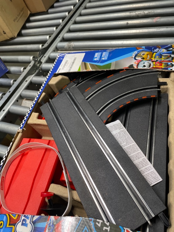 Photo 2 of Carrera GO!!! 63514 Official Licensed PAW Patrol Battery Operated 1:43 Scale Slot Car Racing Toy Track Set with Jump Ramp Featuring Chase and Marshall for Kids Ages 5 Years and Up (20063514)