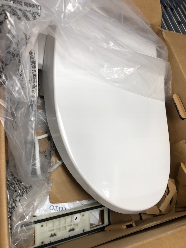 Photo 2 of **ITEM TESTED AND TURNS ON, UNABLE TO TEST FURTHER**
TOTO WASHLET A2 Electronic Bidet Toilet Seat with Heated Seat and SoftClose Lid, Elongated, Cotton White - SW3004#01