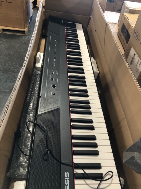 Photo 1 of Alesis Recital – 88 Key Digital Piano Keyboard with Semi Weighted Keys, 2x20W Speakers, 5 Voices, Split, Layer and Lesson Mode, FX and Piano Lessons Recital Piano Only