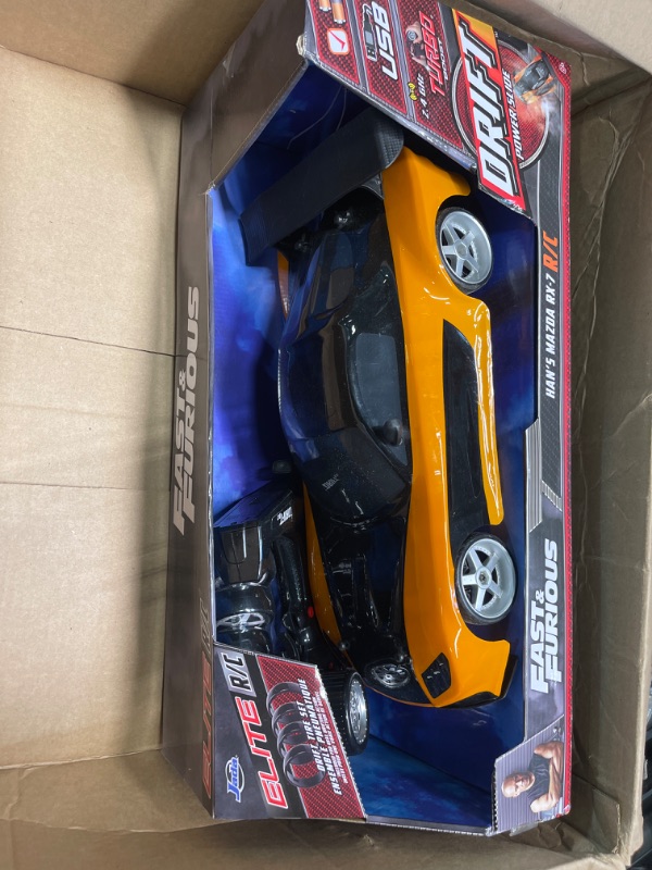 Photo 2 of Jada Toys Fast & Furious Han’s Mazda RX-7 Drift RC Car, 1: 10 Scale 2.4Ghz Remote Control Orange & Black, Ready to Run, USB Charging (Standard) (99700)