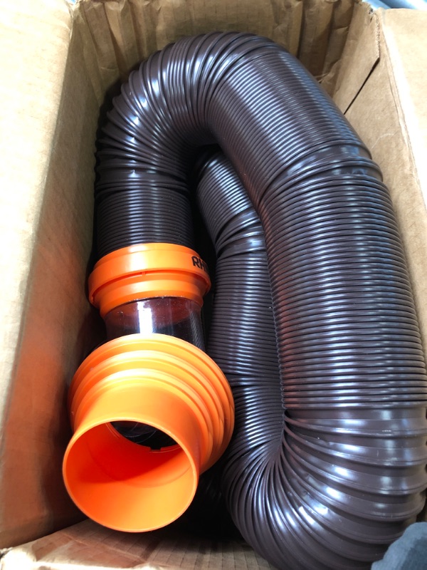 Photo 2 of Camco RhinoFLEX RV Sewer Hose Kit with Swivel Transparent Elbow and 4-in-1 Dump Station Fitting, Brown, 15 Feet (39770) 15ft Sewer Hose Kit Frustration-Free Packaging