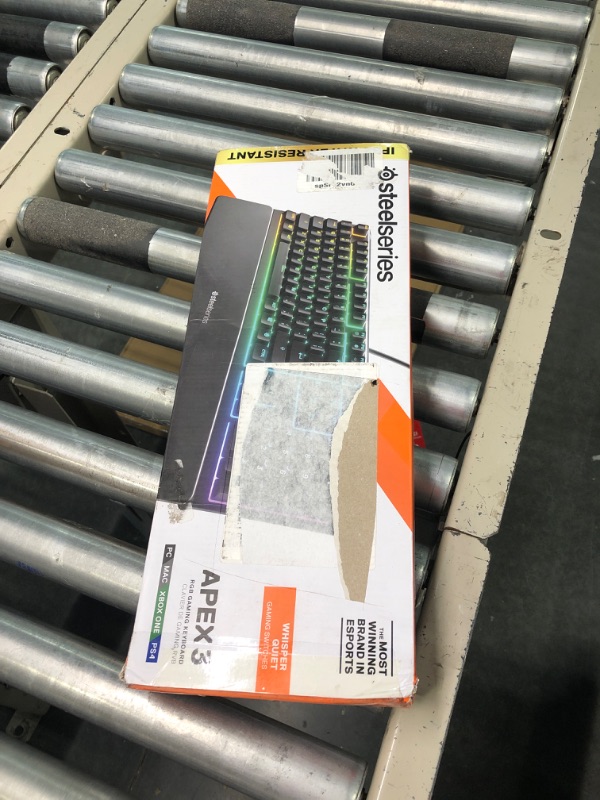 Photo 1 of SteelSeries Apex 3 RGB Gaming Keyboard – 10-Zone RGB Illumination – IP32 Water Resistant – Premium Magnetic Wrist Rest (Whisper Quiet Gaming Switch)