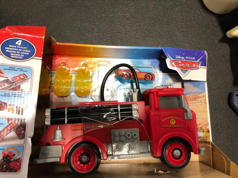 Photo 2 of Mattel Disney Cars Toys Stunt & Splash Red Fire Truck with Color-Change Lightning Mcqueen Toy Car, Working Hose, Dunk Tank & More