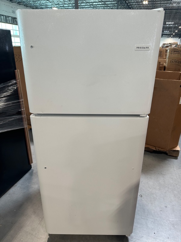 Photo 2 of Frigidaire FFTR2021TW 30 Inch Freestanding Top Freezer Refrigerator with 20.4 cu. ft. Total Capacity, 2 Glass Shelves, 5.1 cu. ft. Freezer Capacity, Right Hinge with Reversible Doors,Hinge in White
