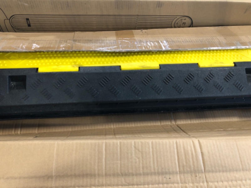 Photo 1 of CXRCY Cable Ramp 3 Pack 2 Channel 11000lbs axle Capacity Floor Cord Cable Protector, Black & Yellow Speed Bumps Hose Protector Ramps for Wire/Hose/Pipe Hider Driveway &Outdoor 40x10x2 inch(L x W x H)