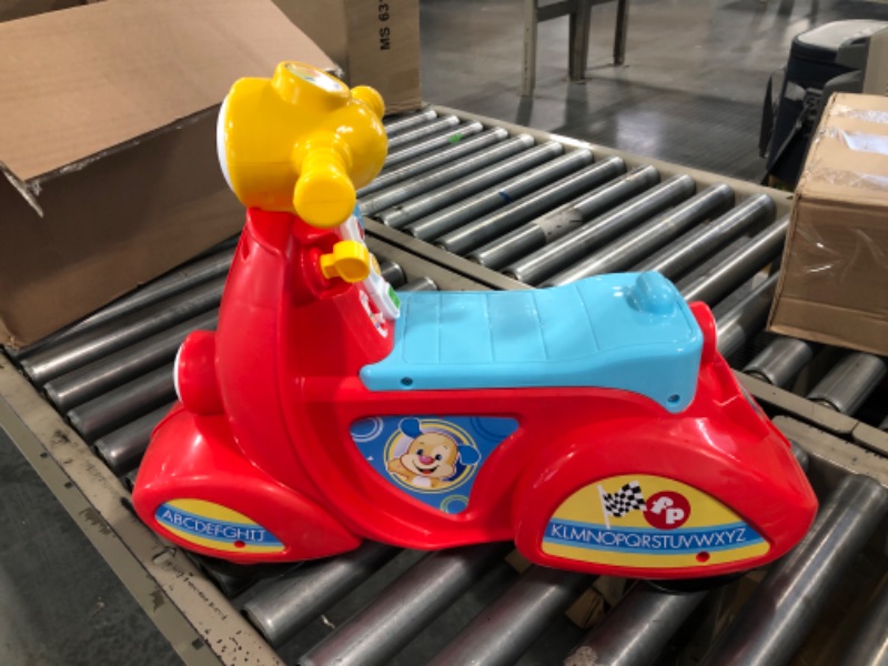 Photo 1 of Fisher-Price Laugh & Learn Smart Stages Scooter, musical ride-on toy with Smart Stages learning content for toddlers ages 1 to 3 years Standard