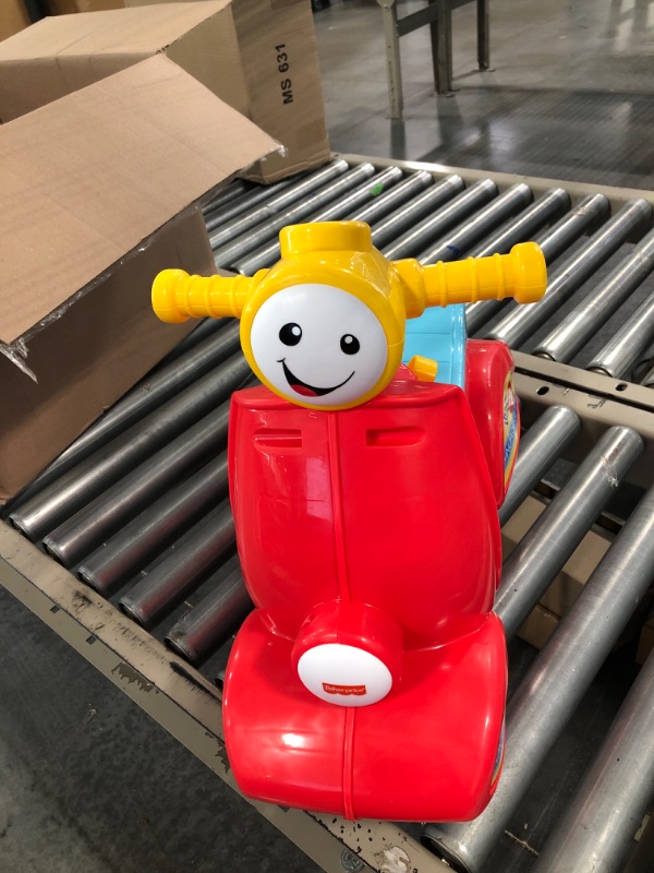 Photo 1 of Fisher-Price Laugh & Learn Smart Stages Scooter, musical ride-on toy with Smart Stages learning content for toddlers ages 1 to 3 years Standard