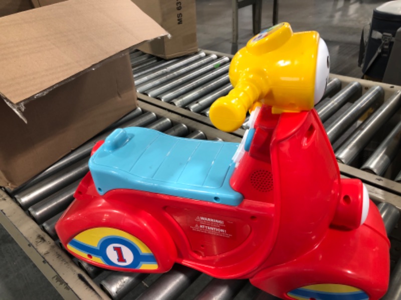 Photo 1 of Fisher-Price Laugh & Learn Smart Stages Scooter, musical ride-on toy with Smart Stages learning content for toddlers ages 1 to 3 years Standard