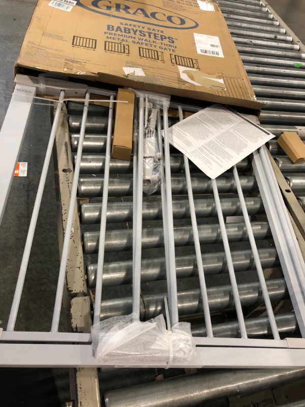 Photo 1 of Graco BabySteps Walk-Thru Metal Safety Gate (Gray) - Pressure-Mounted Baby Gate for Doorway, Expands from 29.5-40.5 Inches, 29.5 Inches Tall, Includes 3 Extensions, Perfect for Children, Pet-Friendly