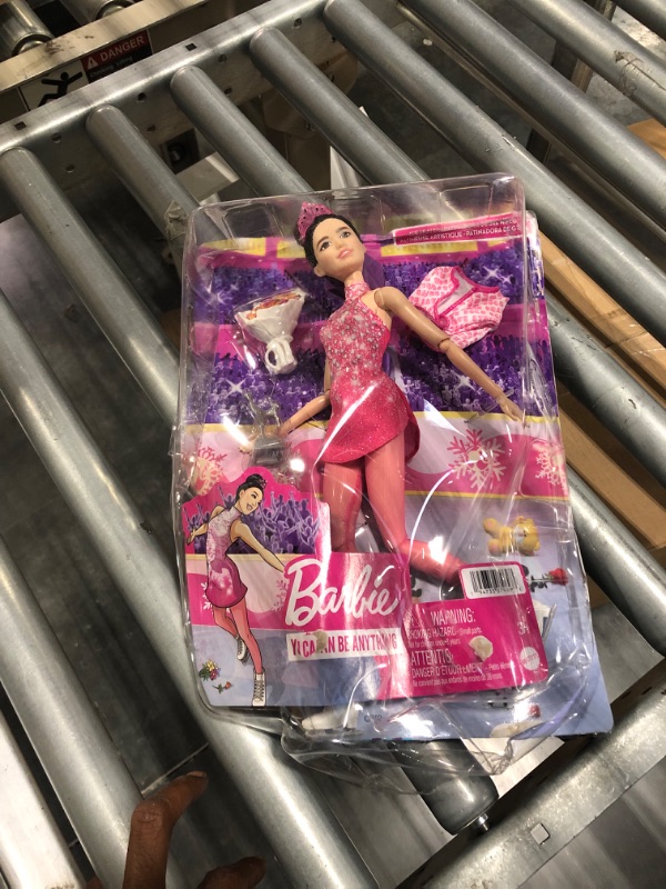 Photo 2 of Barbie Winter Sports Ice Skater Brunette Doll (12 Inches) with Pink Dress, Jacket, Rose Bouquet & Trophy, Great Gift for Ages 3 and Up