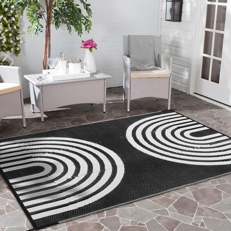 Photo 1 of Anidaroel Outdoor Area Rug for Patio Clearance 5x8ft Waterproof, Reversible Plastic Straw Rug Outside Rug, Stain & UV Resistant RV Mat for Camping, Porch, Balcony, Pool Deck, Black & White