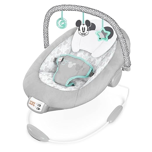 Photo 1 of Bright Starts Mickey Mouse Comfy Disney Baby Bouncer in Cloudscapes Includes -Toy Bar with 3 Cute Toys, Plays 7 Soothing Melodies w/Auto Shut-Off, Age 0-6 Months