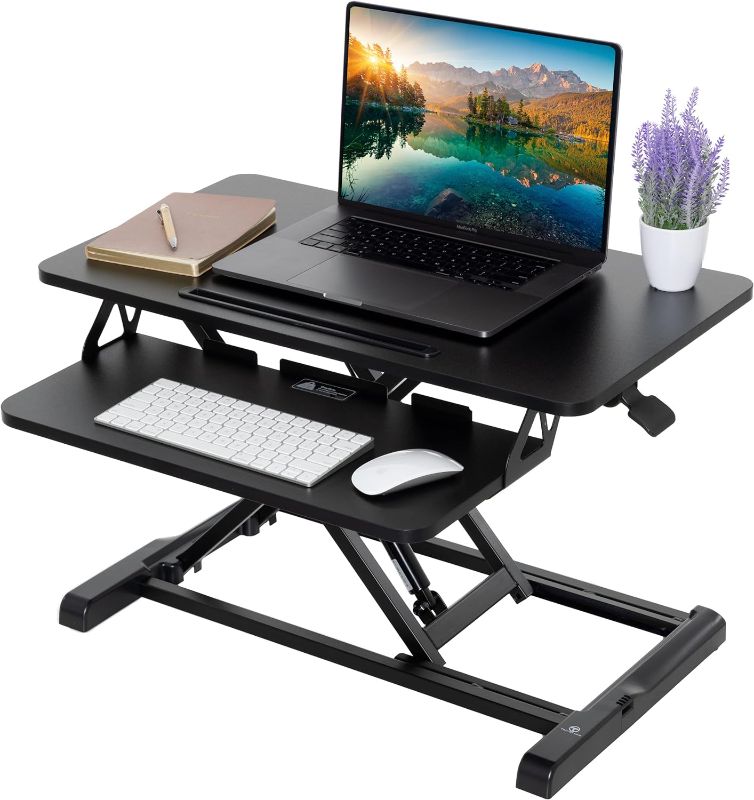 Photo 1 of TechOrbits Standing Desk Converter - Adjustable Sit to Stand Up Desk Workstation, Particle Board, Ergonomic Desk Riser with Keyboard Tray, Desktop Riser for Home Office Laptop, Black 28"
