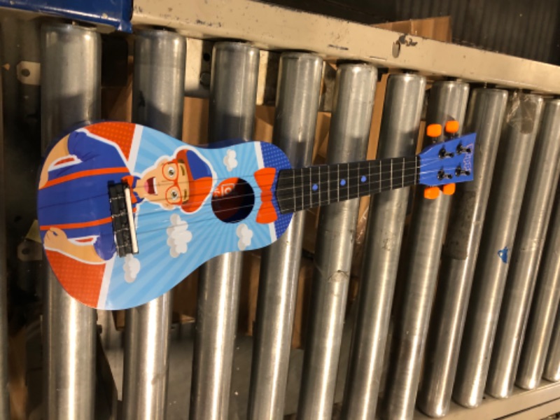 Photo 3 of Blippi Ukulele by First Act, Featuring YouTube Educational Entertainer Ukulele for Beginners, Musical Instruments & Costume Roleplay Accessories, Perfect for Dress Up and Play Time Ukulele + Accessories