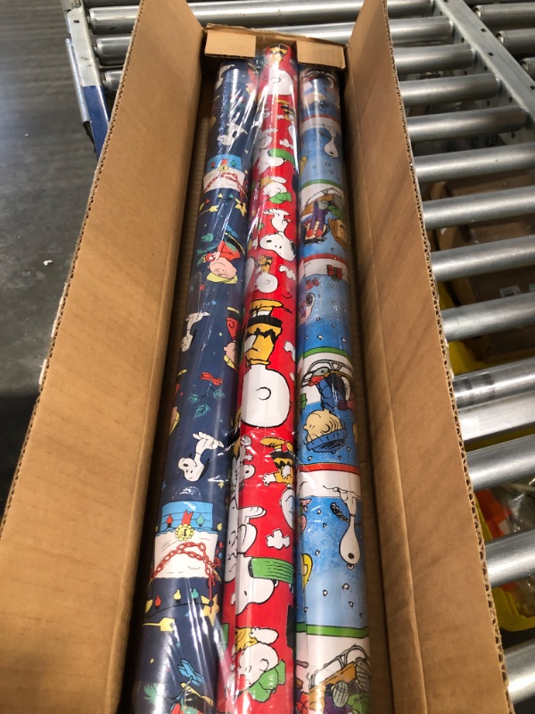 Photo 2 of American Greetings Peanuts Christmas Wrapping Paper Bundle with Cut Lines, Peanuts Characters (3 Rolls, 105 sq. ft.) Peanuts Characters Charlie Brown and Friends