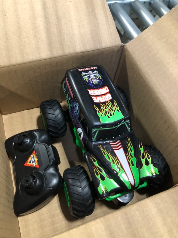 Photo 3 of Monster Jam , Official Grave Digger Remote Control Monster Truck Toy, 1:24 Scale, 2.4 GHz, for Ages 4 and Up