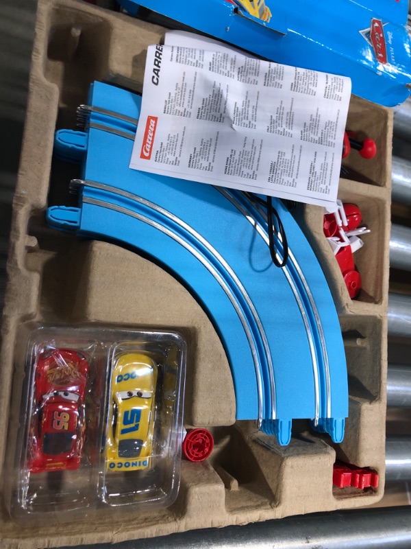 Photo 1 of Carrera First Disney/Pixar Cars - Slot Car Race Track - Includes 2 Cars: Lightning McQueen and Dinoco Cruz - Battery-Powered Beginner Racing Set for Kids Ages 3 Years and Up Disney Cars w/ Spinners