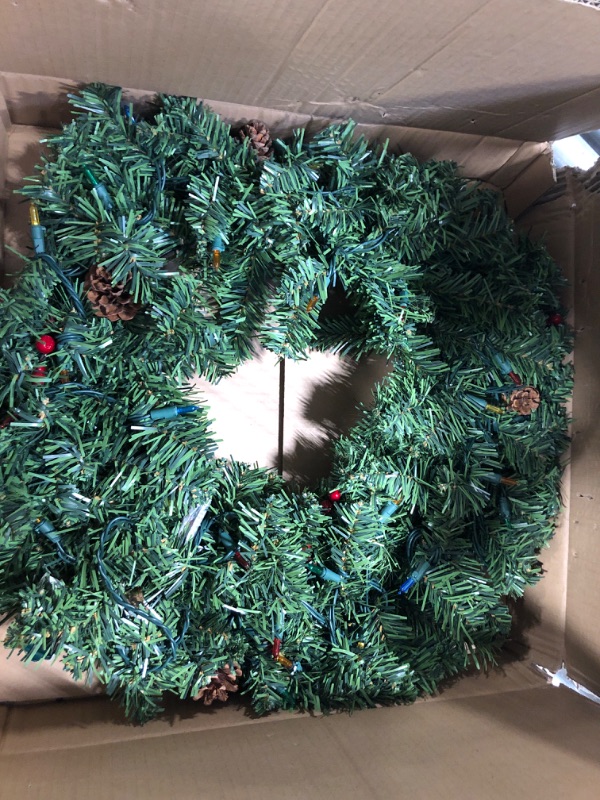 Photo 3 of 24" Christmas Wreath with 50 Count Multicolor Lights, Lighted Artificial Holiday Wreath with UL Listed Plug-in LED String Lights, Red Berries, Natural Pine Cones (Multicolor Lights)