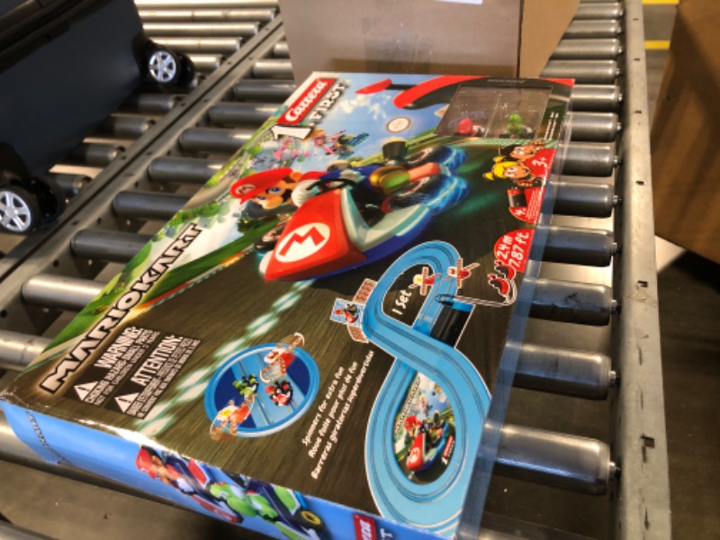 Photo 2 of Carrera First Mario Kart - Slot Car Race Track With Spinners - Includes 2 Cars: Mario and Yoshi - Battery-Powered Beginner Racing Set for Kids Ages 3 Years and Up Mario Kart w/ Spinners