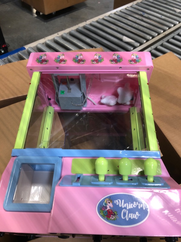 Photo 1 of Bundaloo Unicorn Claw Machine Arcade Game with Lights and Sound, Candy Grabber & Prize Dispenser Vending Toy for Kids with 3 Plush Mini Unicorn Prizes Unicorn Claw with Lights & Plush