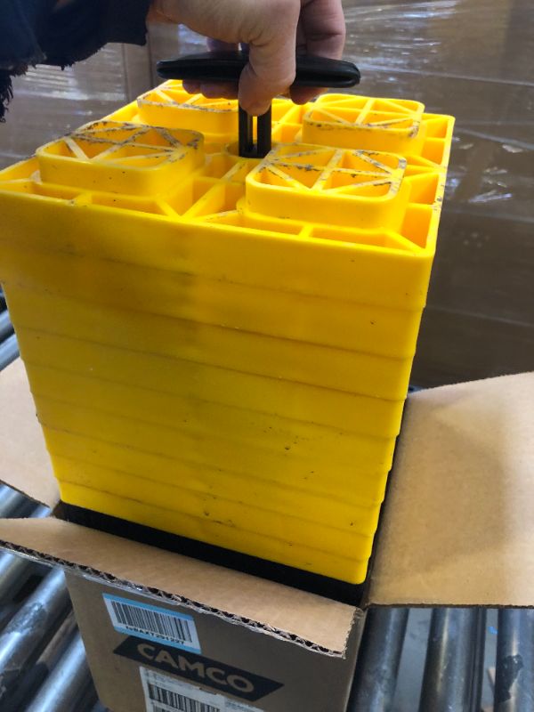 Photo 2 of Camco 21022, FasTen Camper/RV Leveling Blocks | Designed of Heavy-Duty UV Resistant Resin & Convenient Carrying Handle for RV Storage and Organization | Includes (10) 8.5" x 8.5" x 1" RV Blocks Yellow Single Tire Ships In Own Container