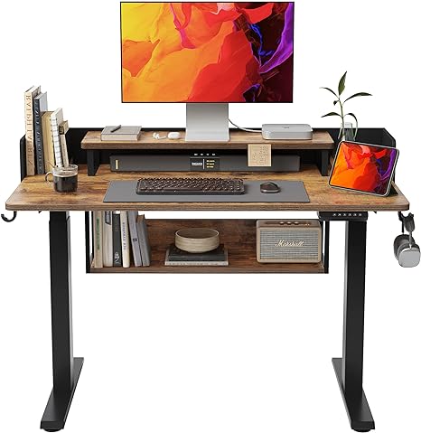 Photo 1 of FEZIBO 48" Electric Height Adjustable Standing Desk with Double Shelves, 48 x 24 Inch Home Office Desk with Monitor Stand and Storage, Sit Stand Rising Desk, Rustic
