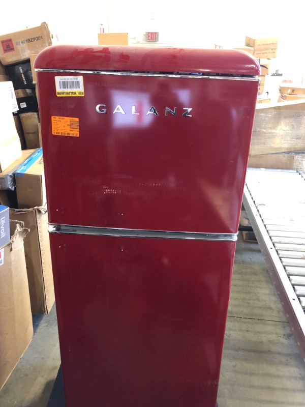 Photo 2 of  Its been used and it smell  it works---Galanz GLR12TRDEFR Refrigerator, Dual Door Fridge, Adjustable Electrical Thermostat Control with Top Mount Freezer Compartment, Retro Red, 12.0 Cu Ft