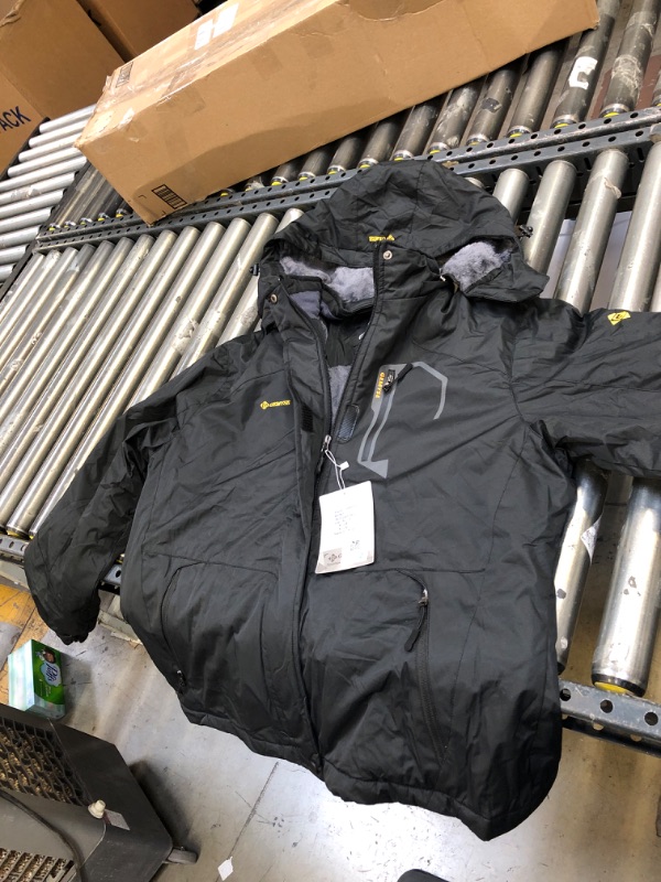 Photo 1 of GEMYSE Men's Mountain Waterproof Ski Snow Jacket Winter Windproof Rain Jacket (Black,Medium)
