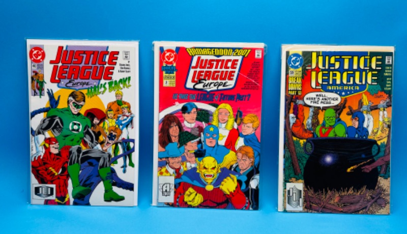 Photo 1 of 626177…3 older justice league comics in plastic sleeves 