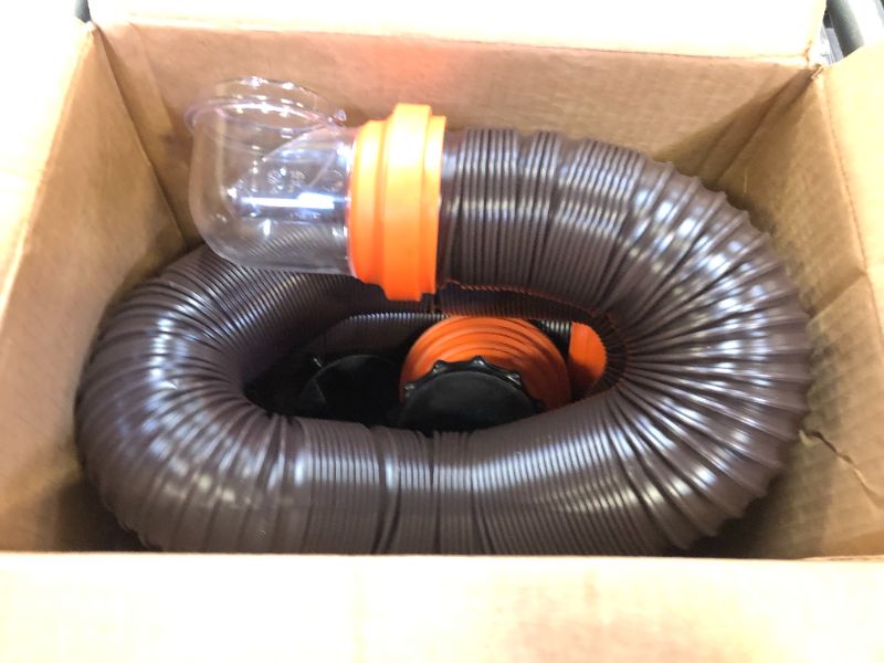 Photo 2 of Camco RhinoFLEX RV Sewer Hose Kit with Swivel Transparent Elbow and 4-in-1 Dump Station Fitting, Brown, 15 Feet (39770) 15ft Sewer Hose Kit Frustration-Free Packaging