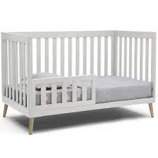 Photo 1 of Delta Children Essex 4-in-1 Convertible Baby Crib, Bianca White with Natural Legs