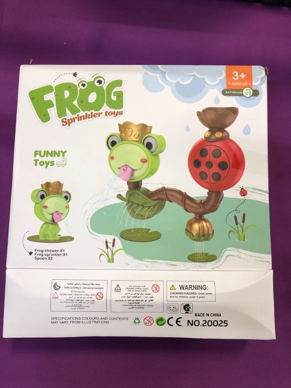 Photo 1 of frog sprinkler toy