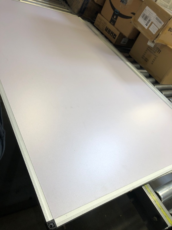 Photo 1 of 35x59 inch white board 