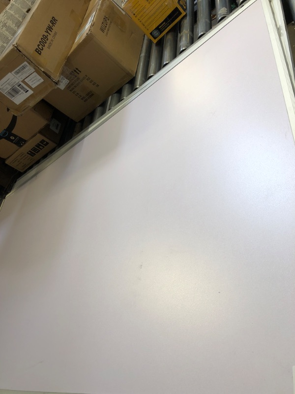 Photo 1 of 35x59 inch white board 