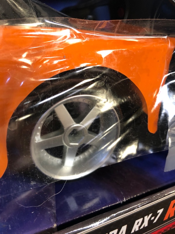 Photo 4 of Jada Toys Fast & Furious Han’s Mazda RX-7 Drift RC Car, 1: 10 Scale 2.4Ghz Remote Control Orange & Black, Ready to Run, USB Charging (Standard) (99700)
